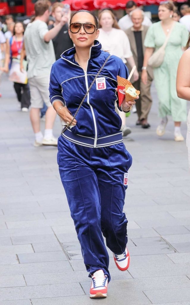 Myleene Klass in a Neon Blue Tracksuit