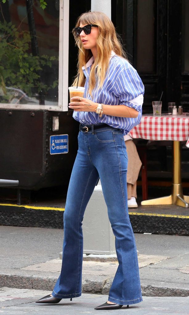 Sarah Holt in a Blue Striped Shirt