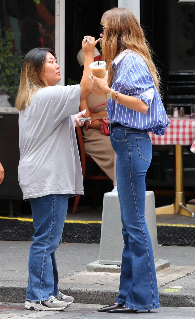 Sarah Holt in a Blue Striped Shirt