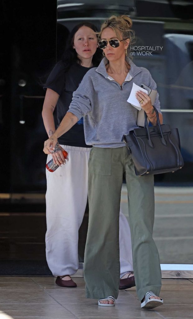 Tish Cyrus in an Olive Pants