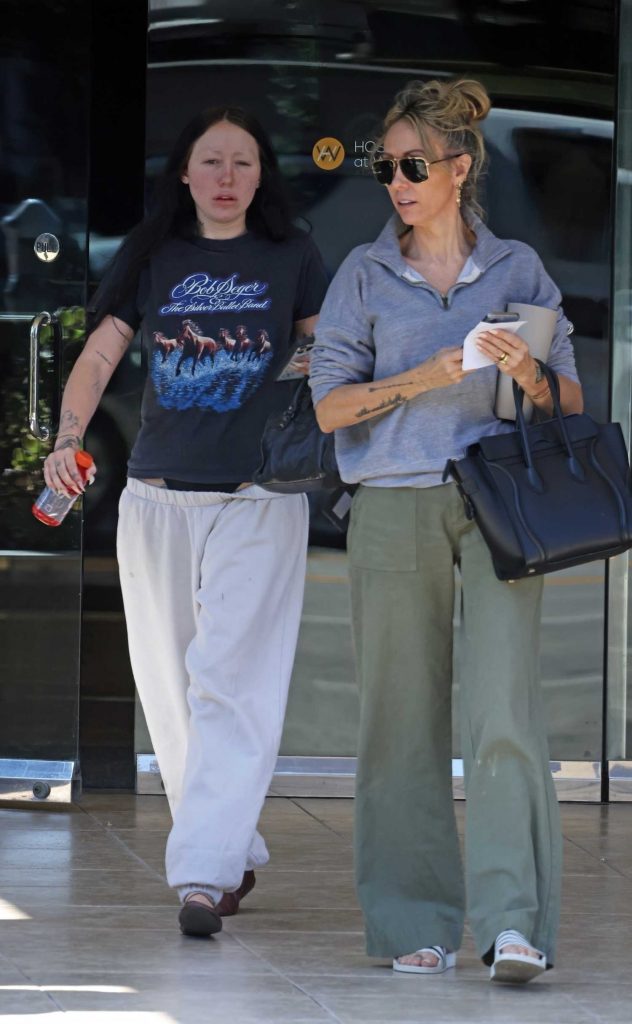 Tish Cyrus in an Olive Pants