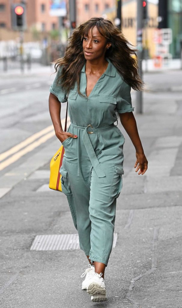 Victoria Ekanoya in a Turquoise Jumpsuit