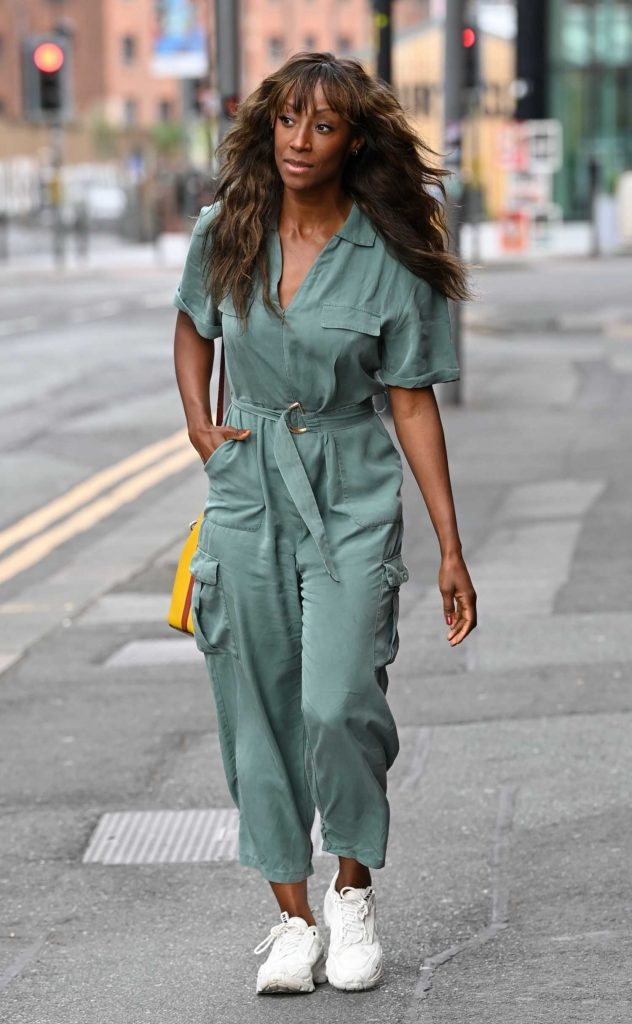 Victoria Ekanoya in a Turquoise Jumpsuit