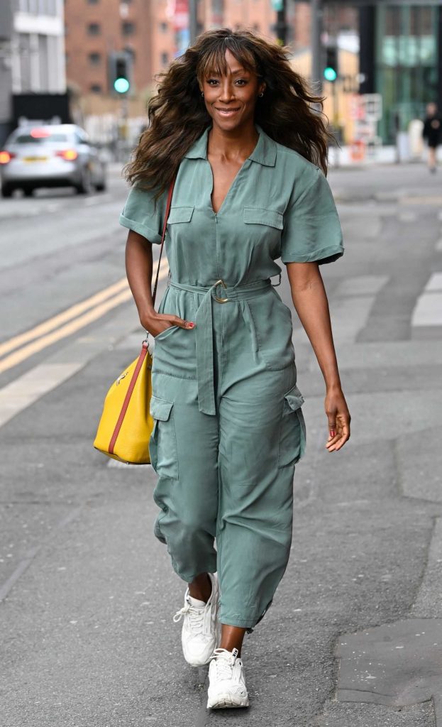 Victoria Ekanoya in a Turquoise Jumpsuit