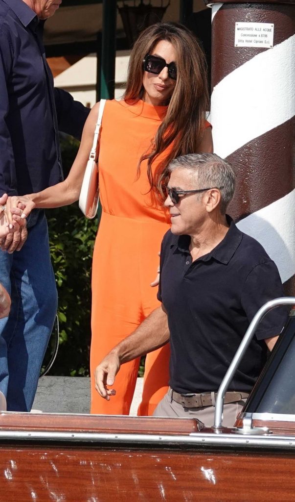 Amal Clooney in an Orange Dress