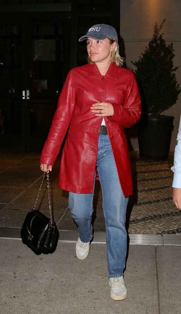 Florence Pugh in a Red Leather Trench Coat