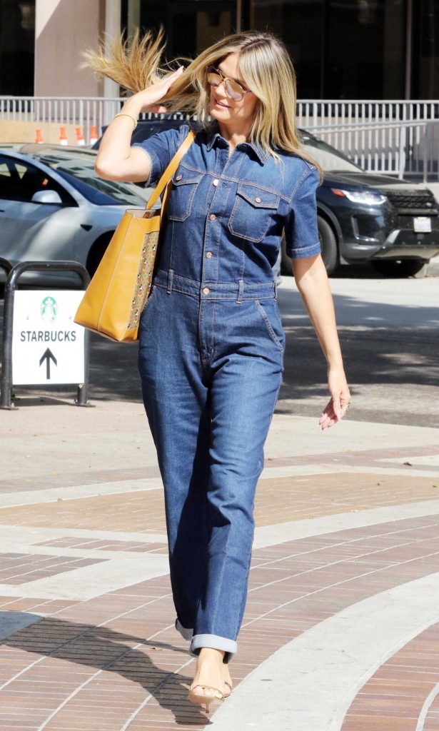 Heidi Klum in a Blue Denim Jumpsuit