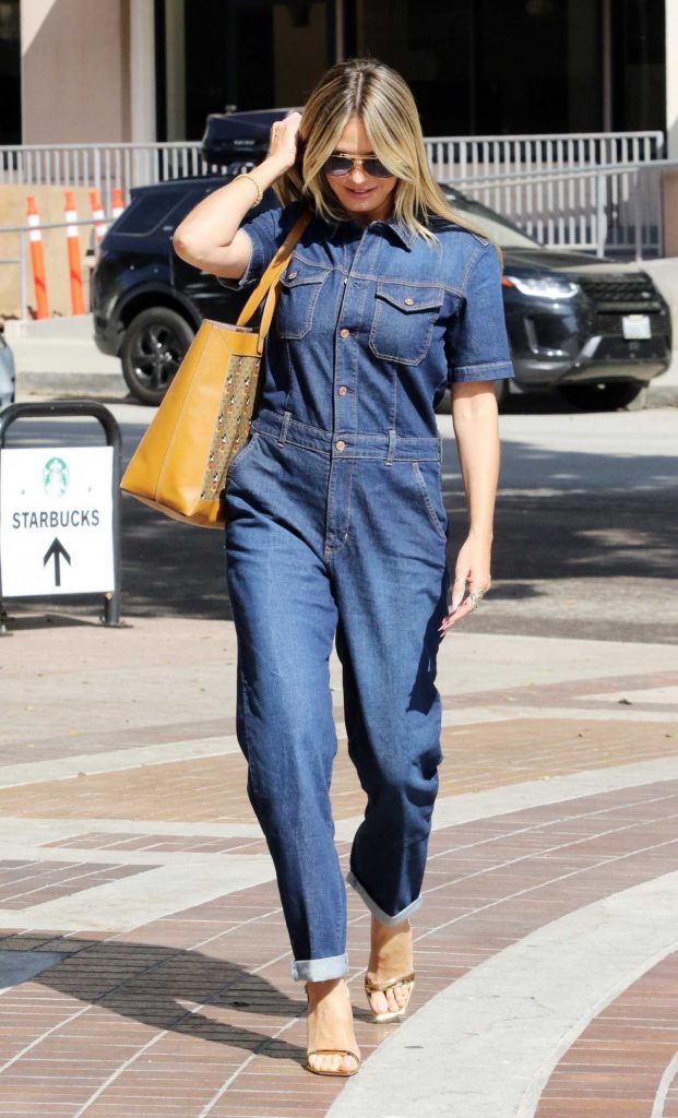 Heidi Klum in a Blue Denim Jumpsuit