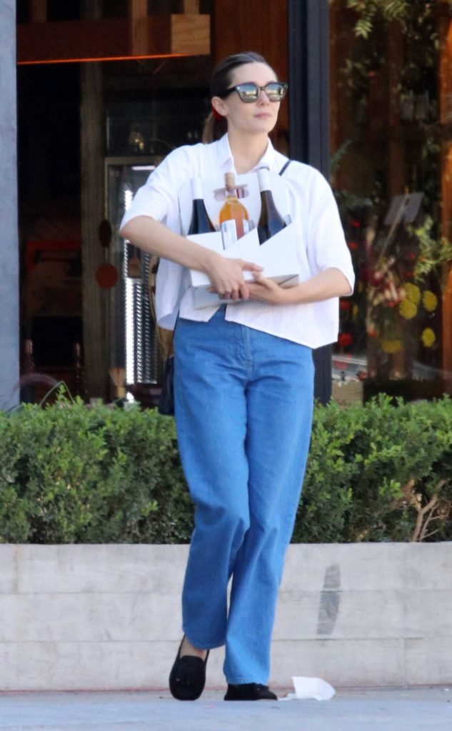 Elizabeth Olsen in a White Blouse