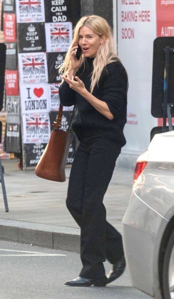 Sienna Miller in a Black Sweater