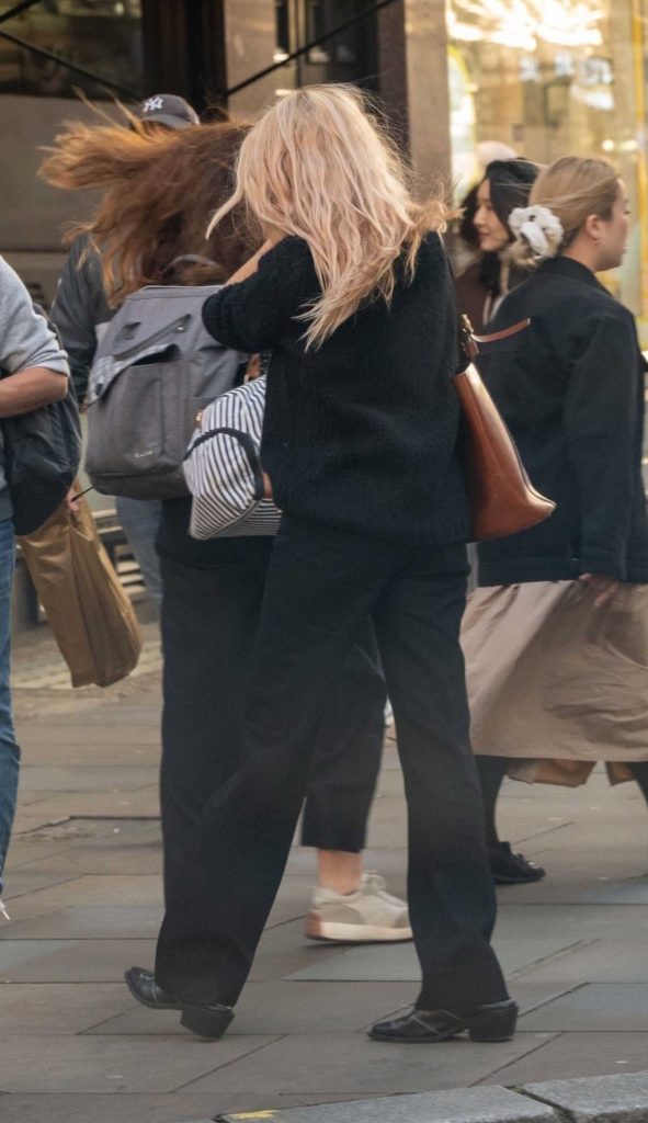 Sienna Miller in a Black Sweater