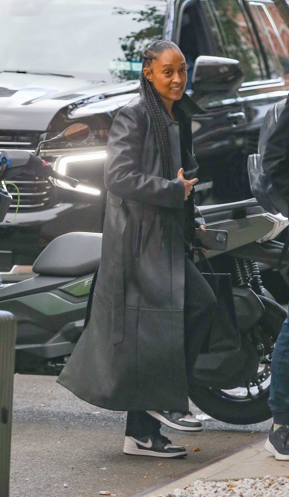 Tia Mowry in a Black Leather Coat