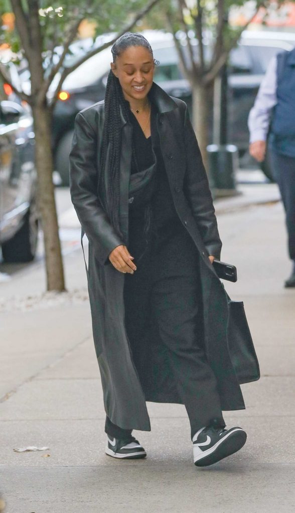 Tia Mowry in a Black Leather Coat