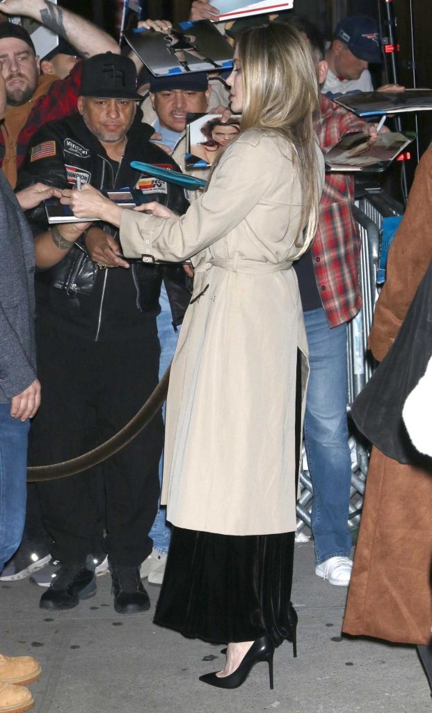 Angelina Jolie in a Beige Trench Coat