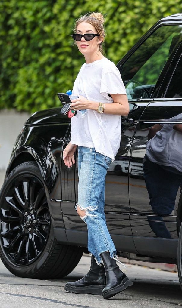 Ashley Benson in a Blue Ripped Jeans