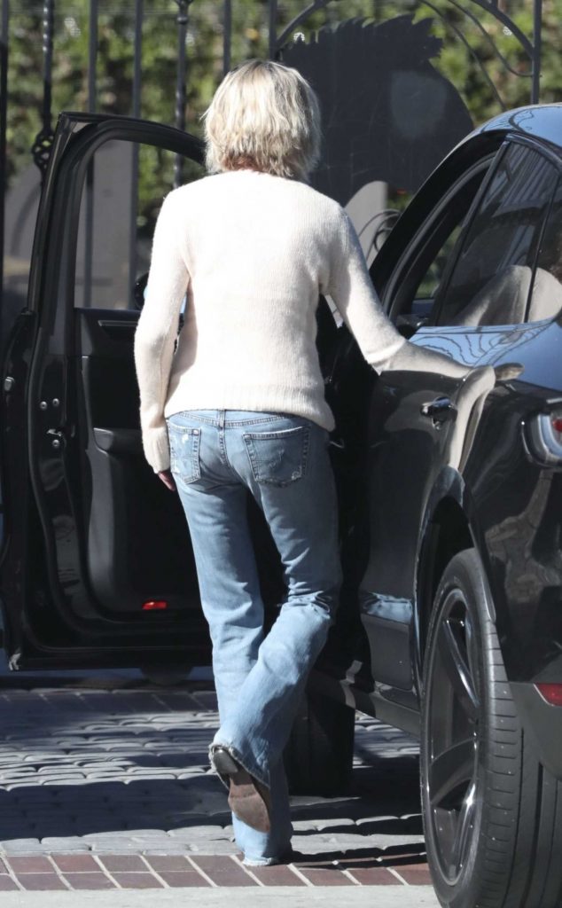 Melanie Griffith in a Beige Sweater