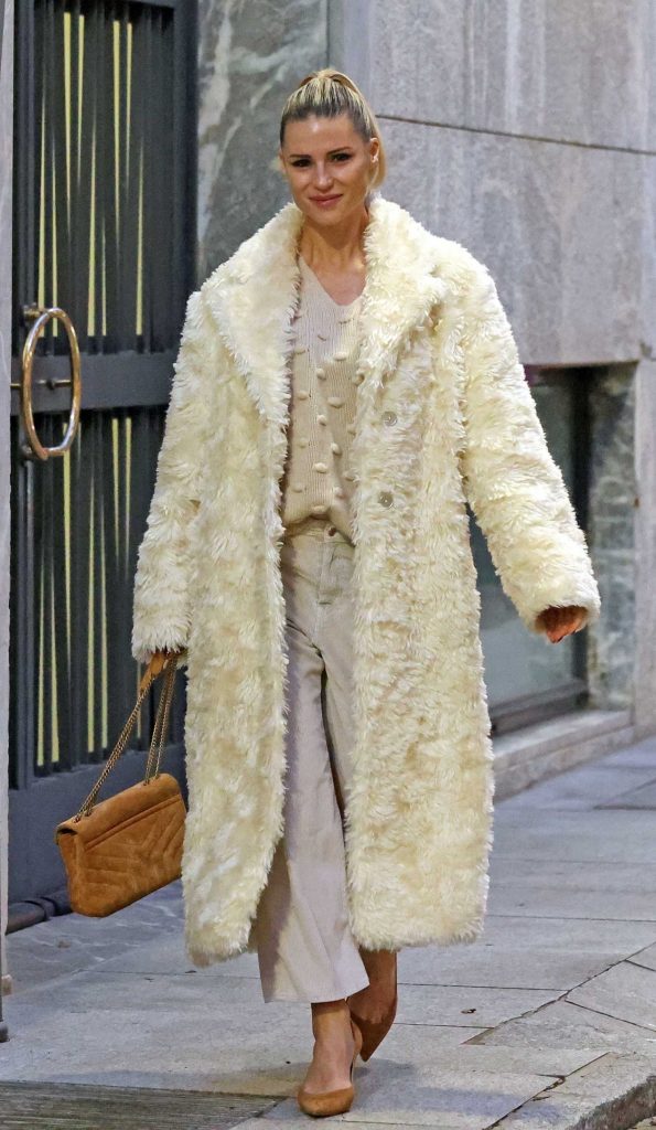 Michelle Hunziker in a White Faux Fur Coat