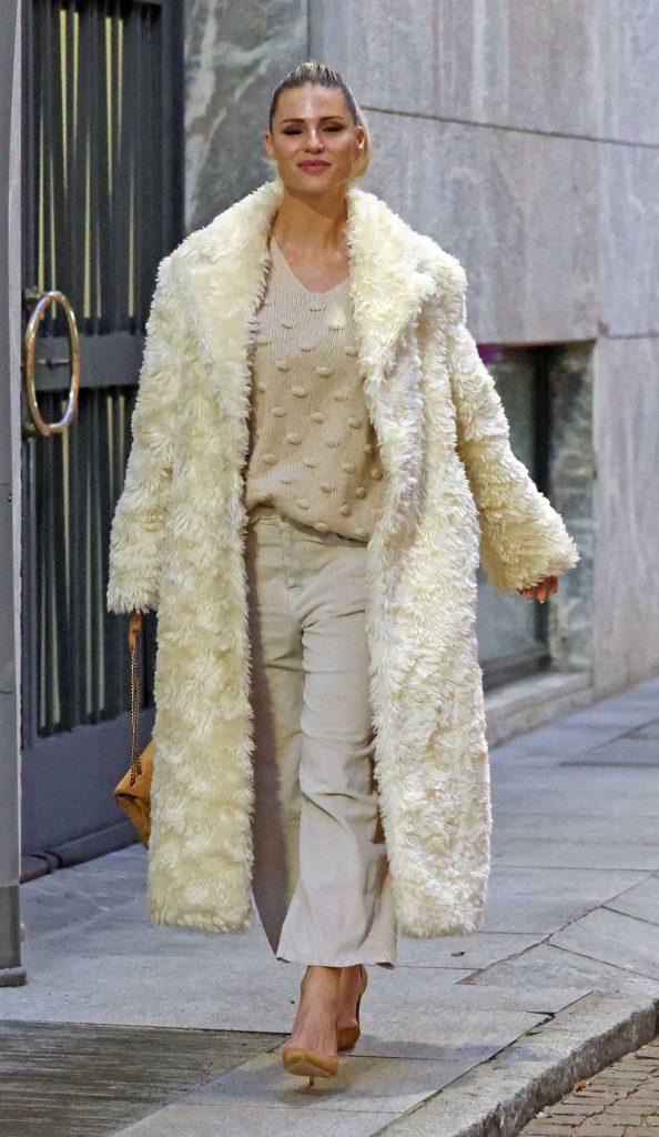 Michelle Hunziker in a White Faux Fur Coat