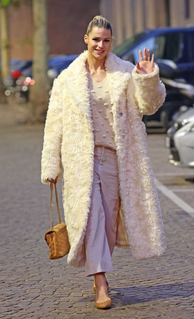 Michelle Hunziker in a White Faux Fur Coat