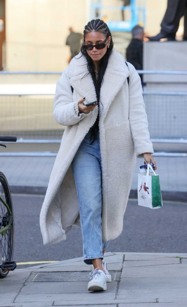 Vick Hope in a White Fleece Coat