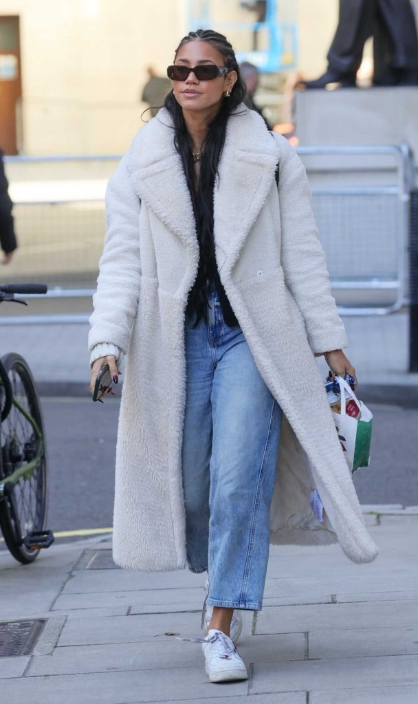 Vick Hope in a White Fleece Coat