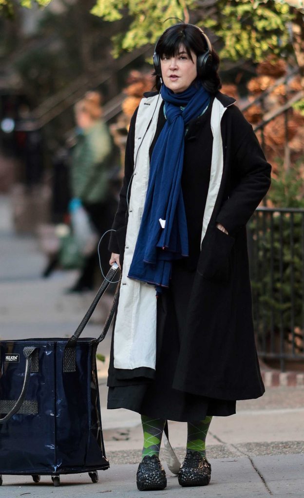 Phoebe Cates in a Black Coat