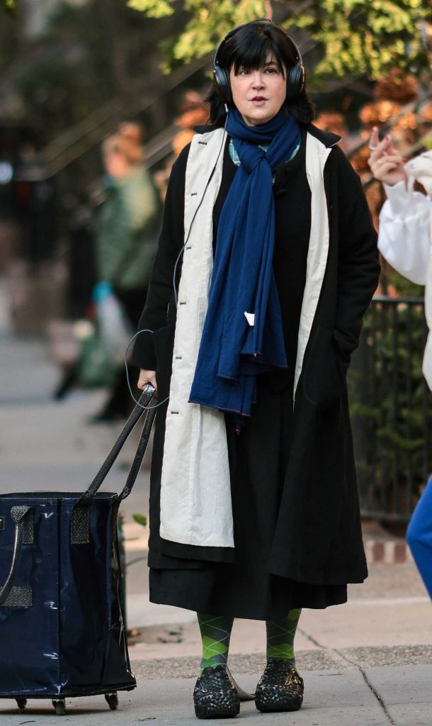 Phoebe Cates in a Black Coat