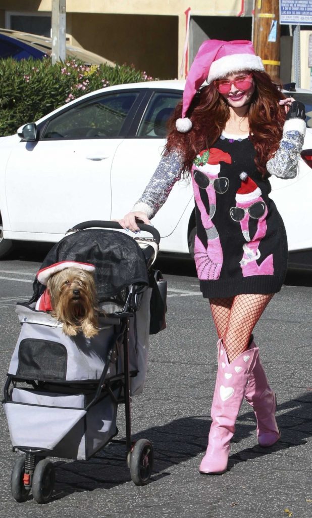 Phoebe Price in a Pink Knee-Length Boots