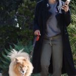 Rachel Lindsay in a Navy Coat Walks Her Dogs in Los Angeles