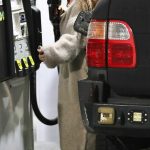 Scout Willis in a Beige Cardigan Pumping Gas Into Her Personalized Lexus in Los Angeles