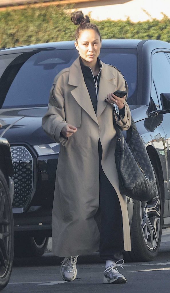 Cara Santana in a Beige Trench Coat