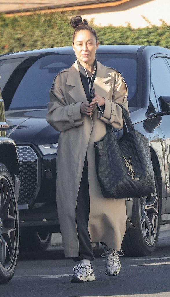 Cara Santana in a Beige Trench Coat