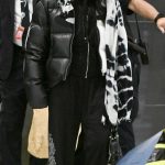 Cher in a Black Puffer Jacket Arrives at JFK Airport in NYC