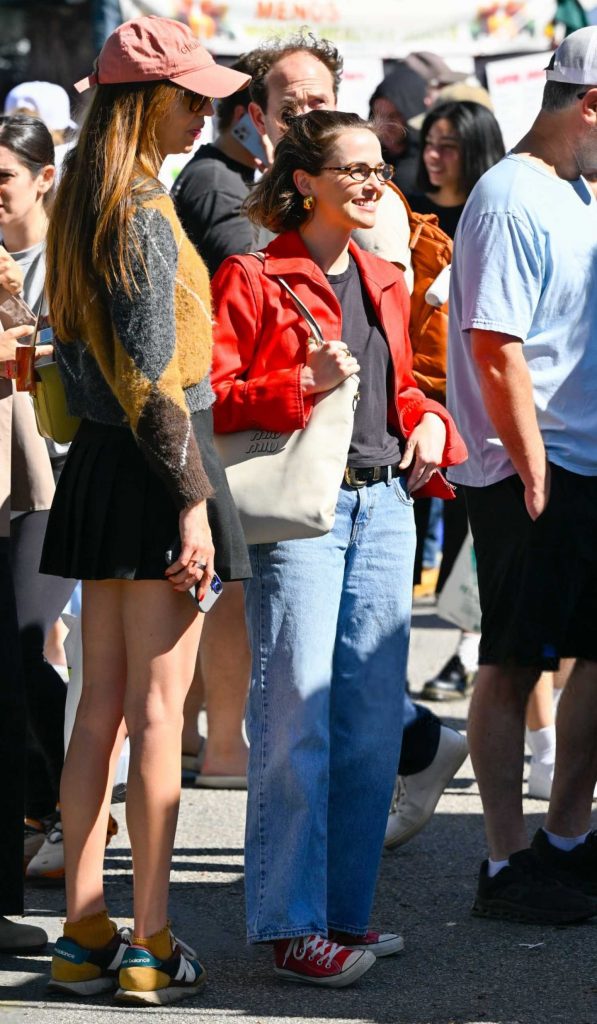 Zoey Deutch in a Red Jacket