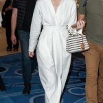 Elle Fanning in a White Dress Leaves the Hotel Martinez in Cannes
