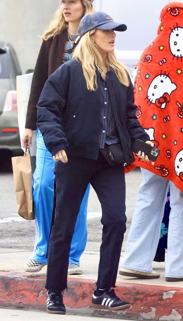 Ellie Goulding in a Black Sneakers
