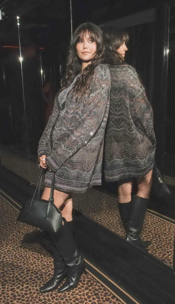 Nina Dobrev in a Black Knee-Length Boots