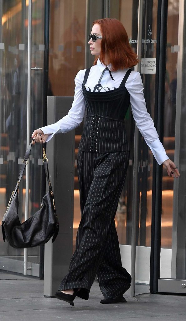 Emily Blunt in a Black Pinstriped Pants