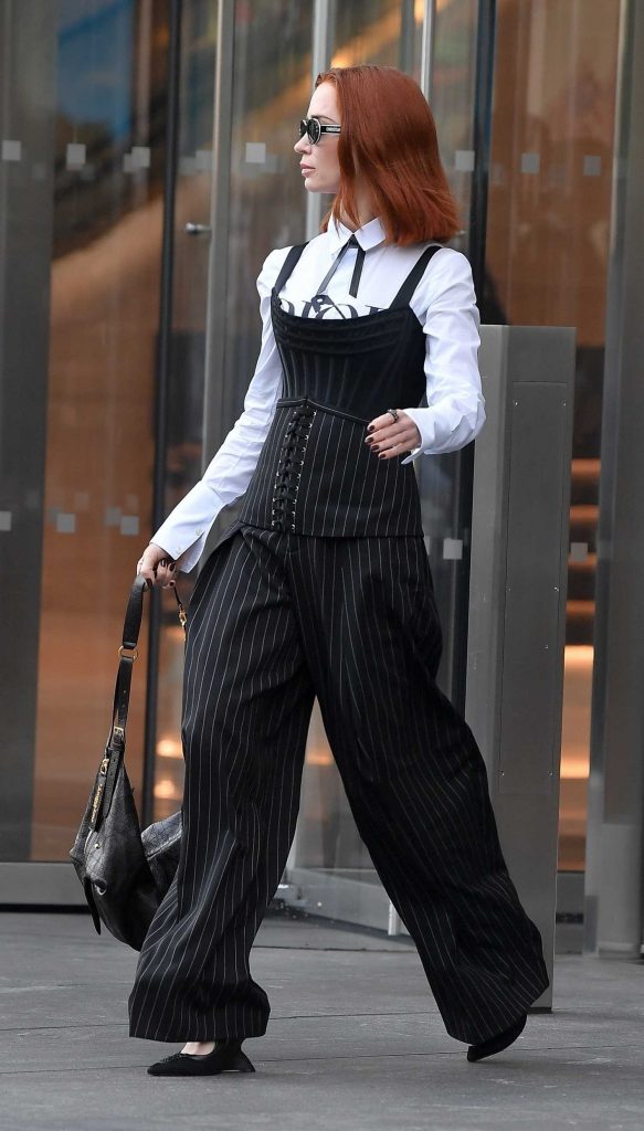 Emily Blunt in a Black Pinstriped Pants