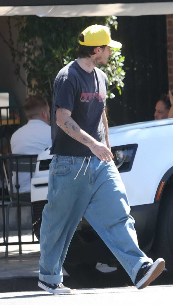Brooklyn Beckham in a Yellow Cap