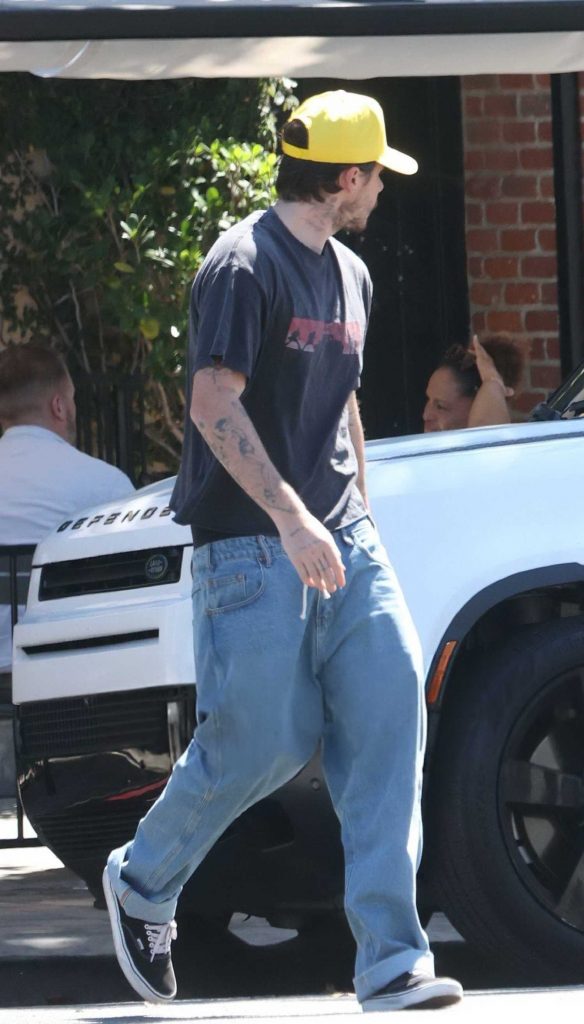 Brooklyn Beckham in a Yellow Cap