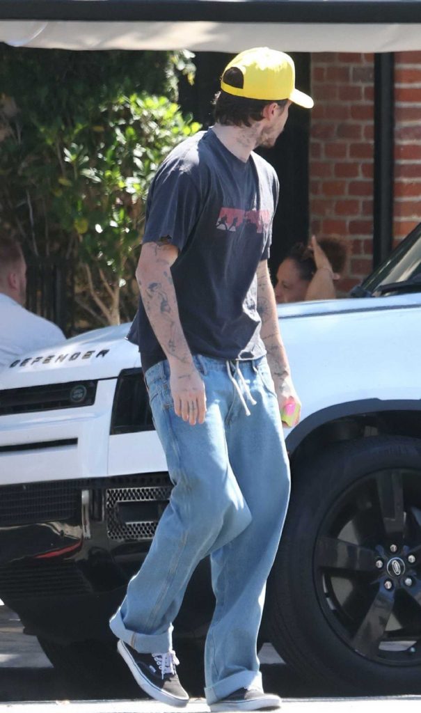 Brooklyn Beckham in a Yellow Cap