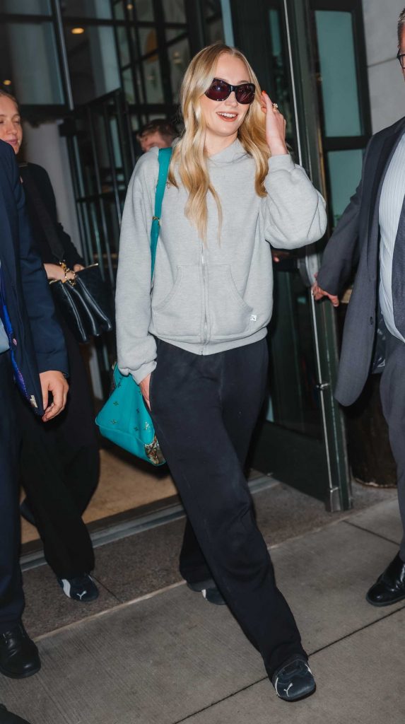 Sophie Turner in a Grey Hoodie