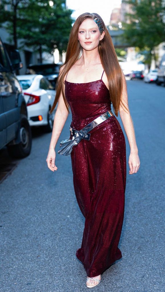 Larsen Thompson in a Burgundy Dress