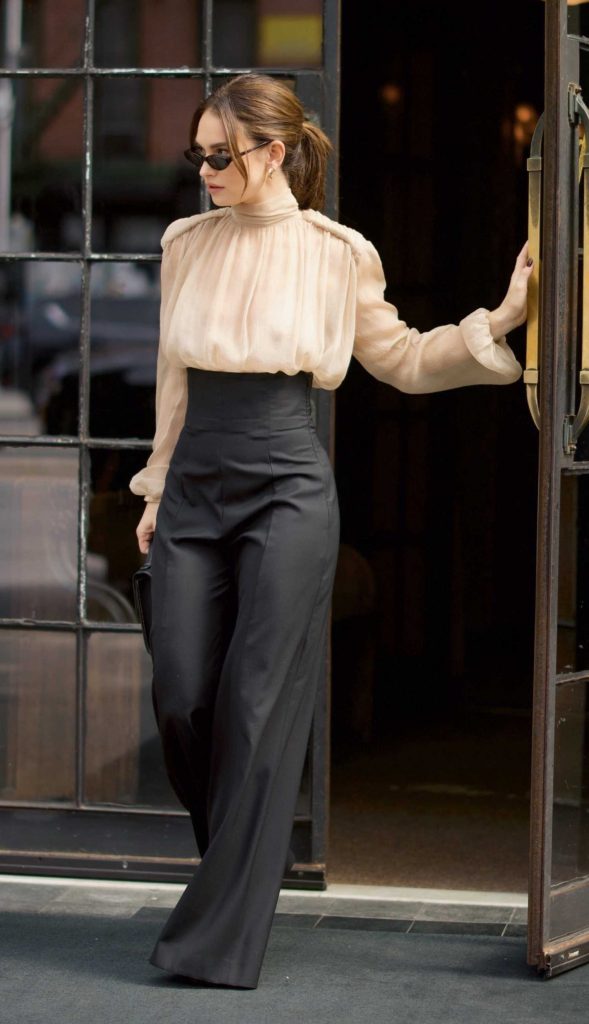 Lily James in a Beige Blouse