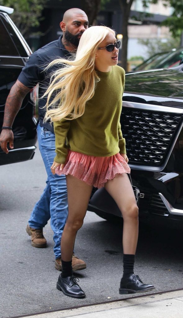 Roseanne Park in an Olive Sweatshirt