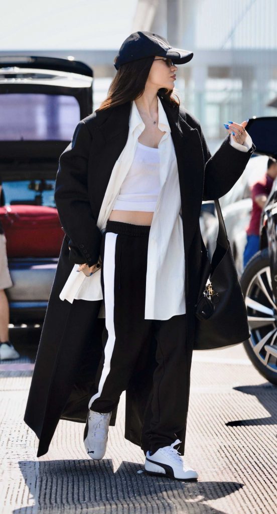 Dove Cameron in a Black Coat