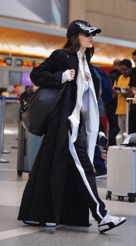 Dove Cameron in a Black Coat