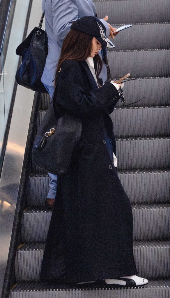 Dove Cameron in a Black Coat