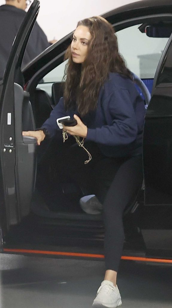 Mila Kunis in a Blue Hoodie